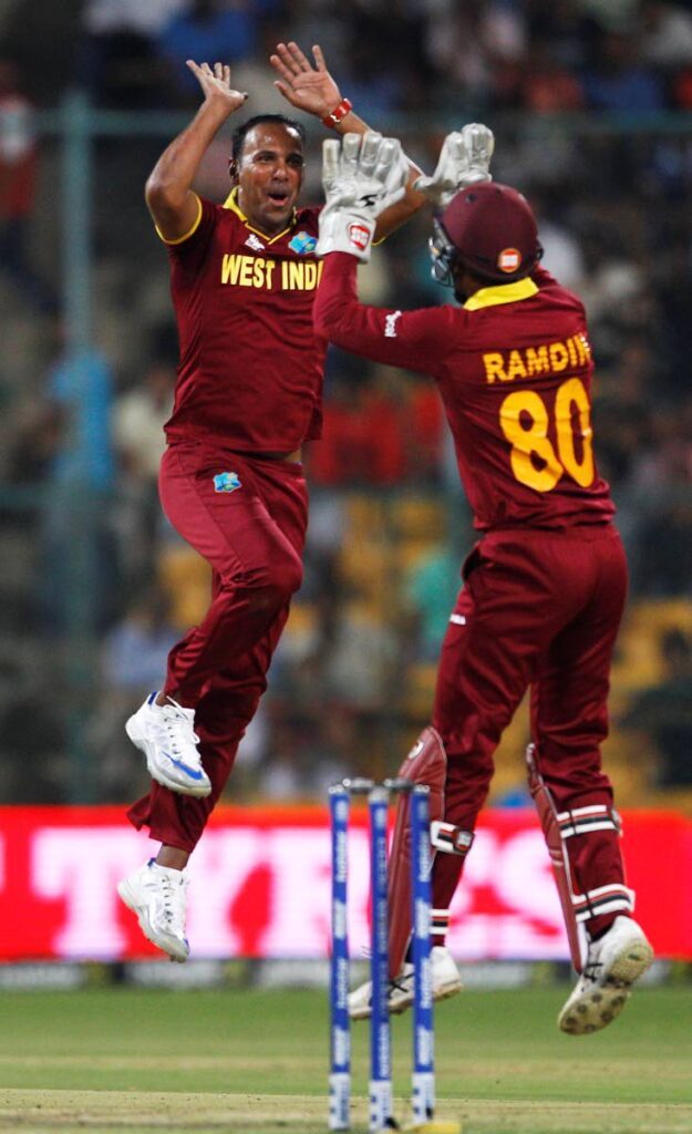 Leg spinner Samuel Badree,left, celebrates a wicket while playing for the West Indies in the ICC World T20 tournament in 2016.  - 