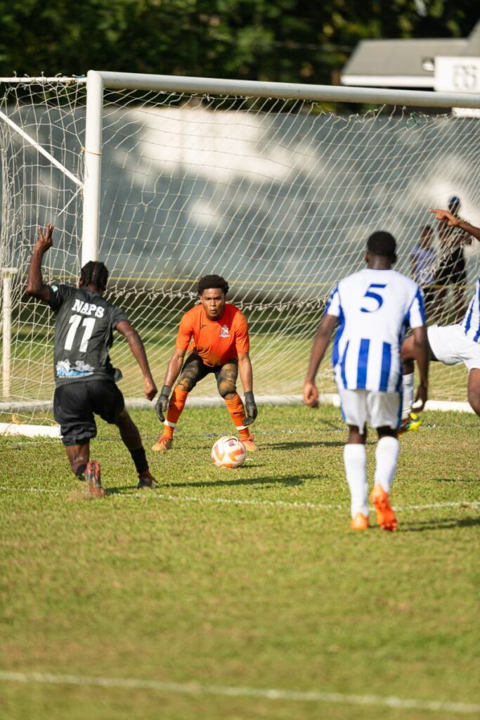 Naparima College’s Akiel Vesprey, left, shoots to score past St Mary’s goalie Jabali Doyle, while centre back Mekhi Pascal could only look on during their SSFL clash, at St Mary’s Ground, St Clair on September 16. - 
