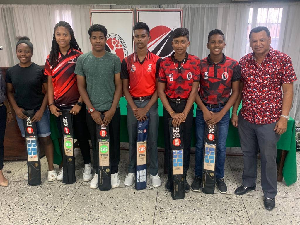 Hafiz Mohammed, right, owner of donor Transbrokerage Services Limited with the recipients of equipment bags and bats, from left, Djenaba Joseph, Kdjazz Mitchell, Israel Gonzales, Amit Chan, Ganesh Gobin, and Reyad Jerome, at the National Cricket Centre, Couva. - 