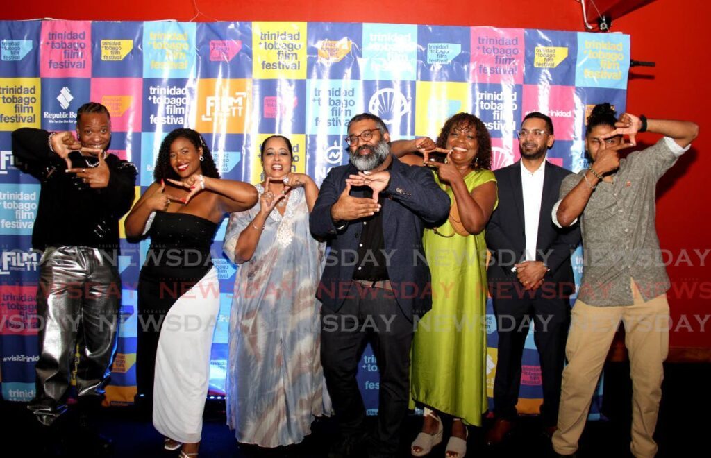 Doubles filmmaker Ian Harnarine, centre, takes a photo with actors Isaiah Alexander, left, Gabrielle Alleyne, Patti-Anne Ali, Penelope Spencer, Sanjiv Budhu, and producer Mark Sirju at the launch of the TTFF on September 20, at Queen's Hall, St Ann's. - AYANNA KINSALE