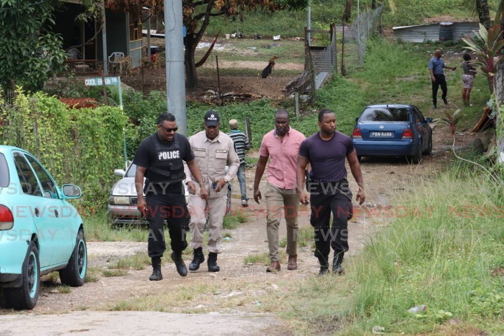 Police at the scene of a mass shooting at Retreat Extension Road, Guanapo, Arima on Thursday. - ROGER JACOB