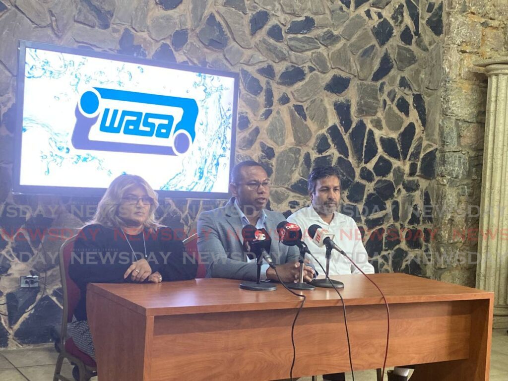 WASA CEO Kelvin Romain (centre) sits alongside the company's acting director of operations Sahira Ali (left) and the head of operations in south Anand Jaggernath (right) at a press conference at WASA's head office, Farm Road, St Joseph on Thursday. - Photo by Narissa Fraser