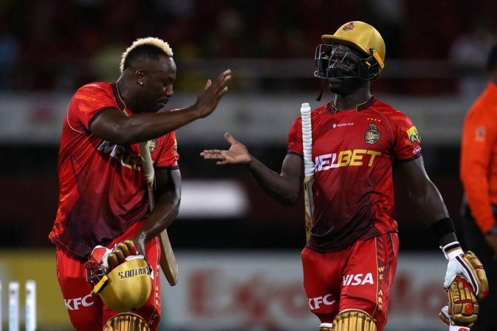 Trinbago Knight Riders allrounder Andre Russell, left, congratulates Chadwick Walton after his match-winning knock against Guyana Amazon Warriors in a Republic Bank Caribbean Premier League match, at the Providence Stadium, Guyana, Wednesday. PHOTO COURTESY TRINBAGO KNIGHT RIDERS - 