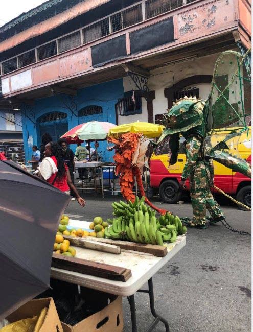 Two dragon mas players walk the streets of Port of Spain  - Courtesy Neisha Agostini