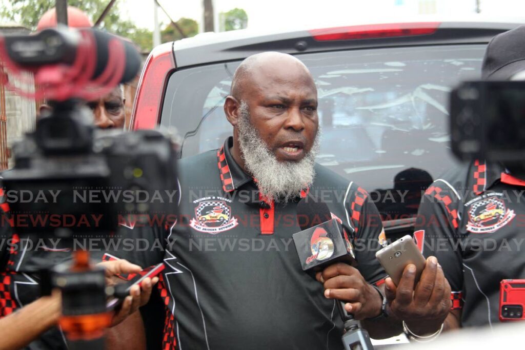 President of the Trinidad and Tobago Taxi Drivers Network Adrian Acosta speaking at a press conference on Library corner San Fernando on Friday.   - Lincoln Holder