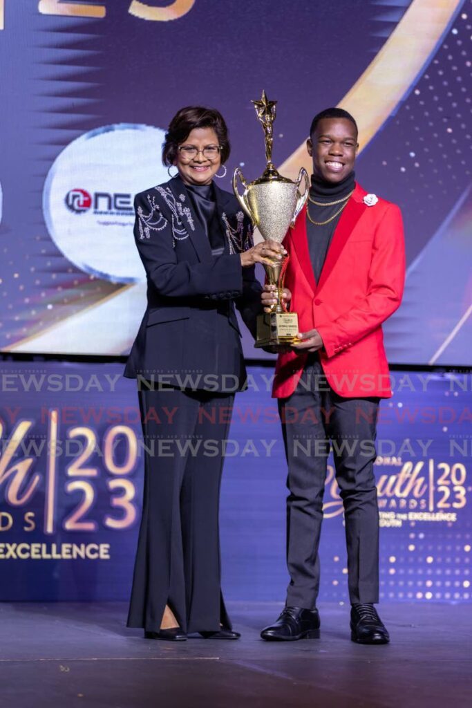 President Christine Kangaloo presents agriculture entrepreneur Jahmali Samuel with the Youth of the Year (ten-17 category) award during the Ministry of Youth Development and National Service National Youth Awards 2023 at the Hyatt Regency Trinidad, Port of Spain on September 21. - Jeff K. Mayers