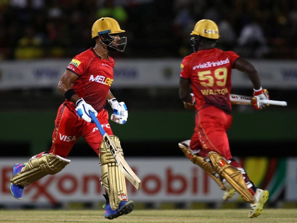 Trinbago Knight Riders’ Nicholas Pooran (L) and Chadwick Walton run between the wickets during the Republic Bank Limited Caribbean Premier League T20 match, on Wednesday, at the Providence Stadium, Georgetown, Guyana.  - Trinbago Knight Riders