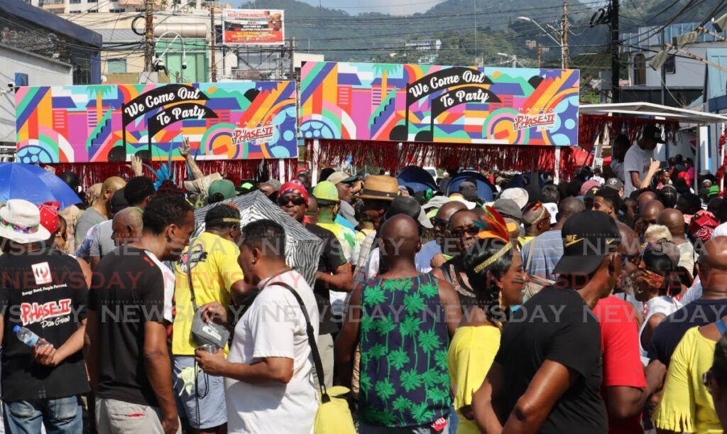 Revellers enjoy the First Jam J'Ouvert hosted by PanTrinbago and Shell Invaders in Woodbrook on Sunday. - Photo by Roger Jacob