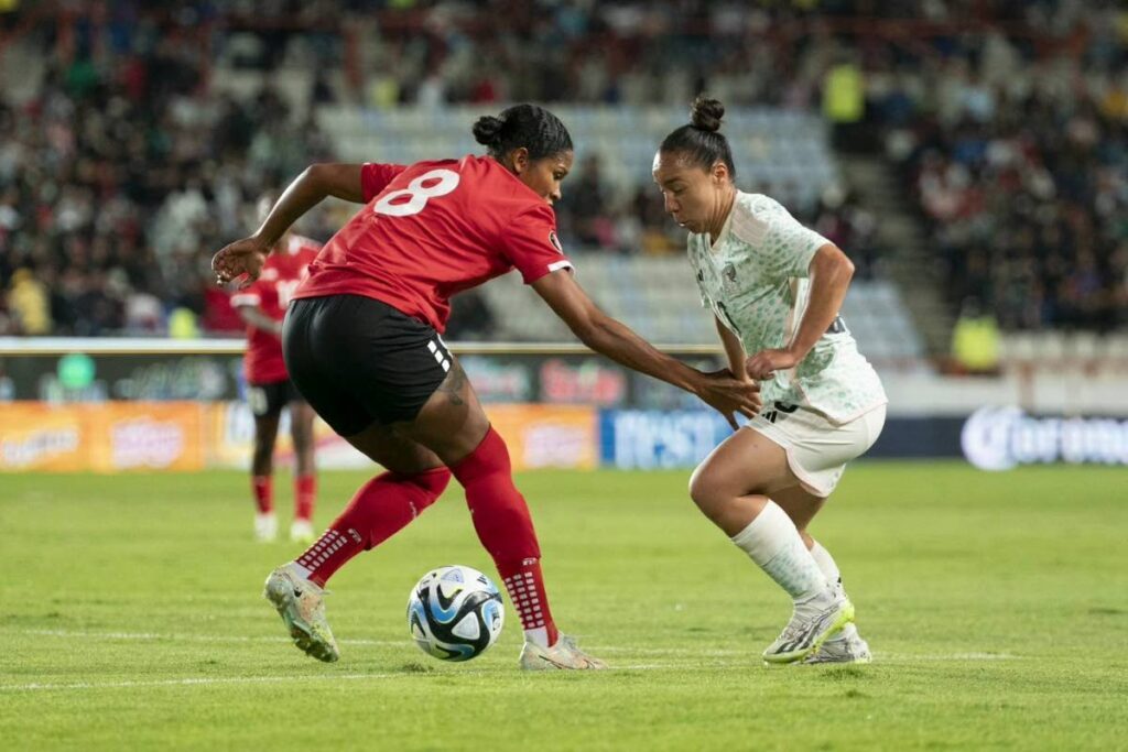 Trinidad and Tobago's Victoria Swift (L) vies for control of the ball against Mexico, on Tuesday, during their 2023 Concacaf Gold Cup qualifying match, at the Estadio Hidalgo Stadium, Pachuca, Mexico. - TTFA Media
