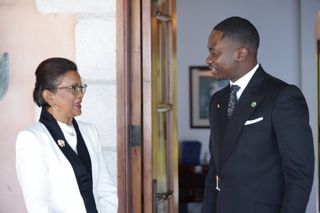 President Christine Kangaloo and Chief Secretary Farley Augustine speak during the President's visit to the Assembly Chambers Scarbrough, Tobago on September 27.  - Photo courtesy THA