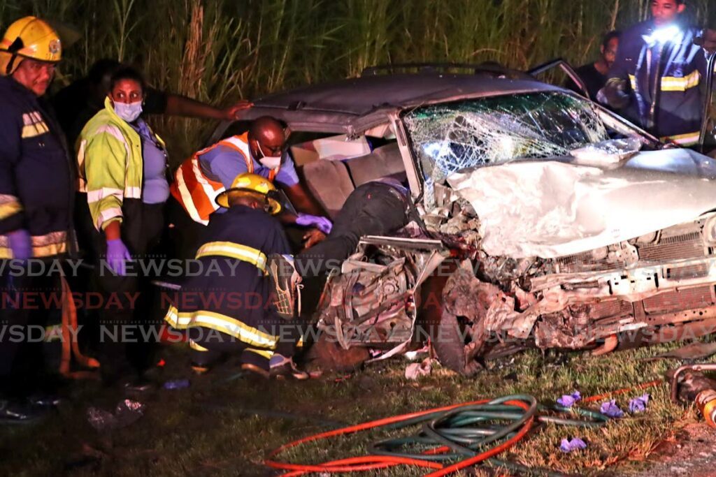 In this file photo, first responders are on the scence after two vehicles collided head on near Peter Circular Road on the Eastern Main Road on July 28. - Photo by Roger Jacob