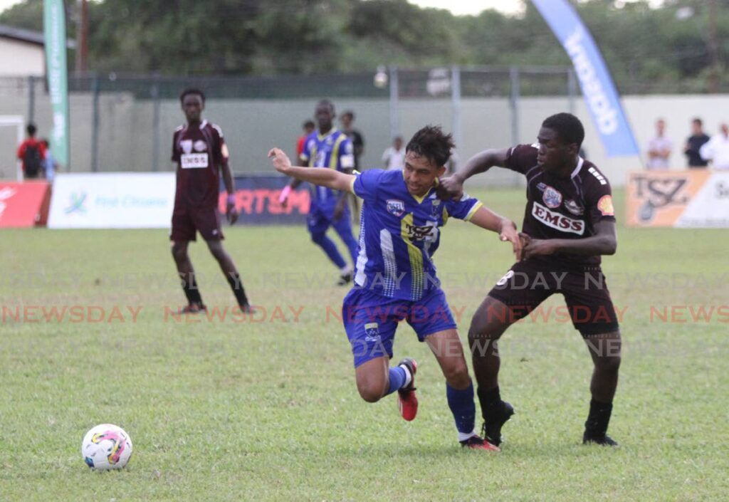 In this September 20 file photo, Fatima College’s Elijah Camacho (L) and East Mucurapo Secondary School Khidr Atiba go after the ball during the SSFL Premiership Division at Fatima Grounds, Mucurapo. Fatima face Presentation College San Fernando on Wednesday in their round seven match at the Fatima College Grounds, Mucurapo.  - Ayanna Kinsale