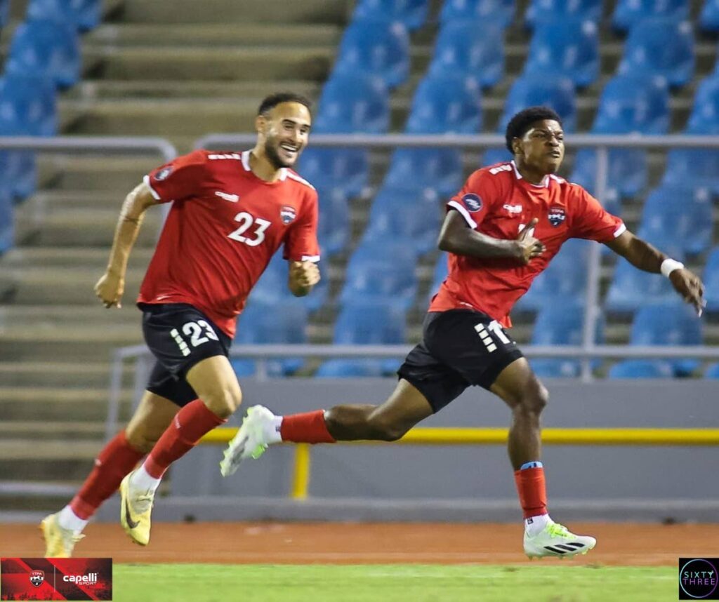 Trinidad and Tobago footballer Nathaniel James (R) celebrates scoring against Curacao, on September 7, 2023 during their Concacaf Nations League match, at the Hasely Crawford Stadium, Port of Spain. - TTFA Media