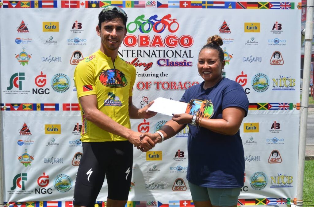 2023 Tobago International Cycling Classic winner Eder Freyre of Mexico receives a prize from an official after winning the final stage on Sunday.  - Courtesy TICC