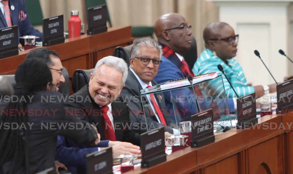 Minister of Finance Colm Imbert is congratulated after his 2023/2034 budget presentation by Minister of National Security Fitzgerald Hinds at Parliament, Port of Spain on Monday.  - Angelo Marcelle