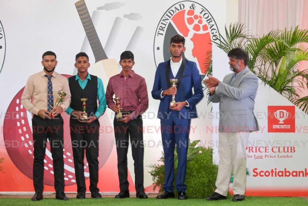 Youth MVP awards were presented by Price Club's Shamshad Ali, right, to (left to right) U19 player Andrew Rambaran, U13 player Reyad Jerome, U15 player Brendad Boodoo and U17 Aadian Racha, during the TTCB awards at the Center Point Mall Auditorium on Saturday in Chaguanas.