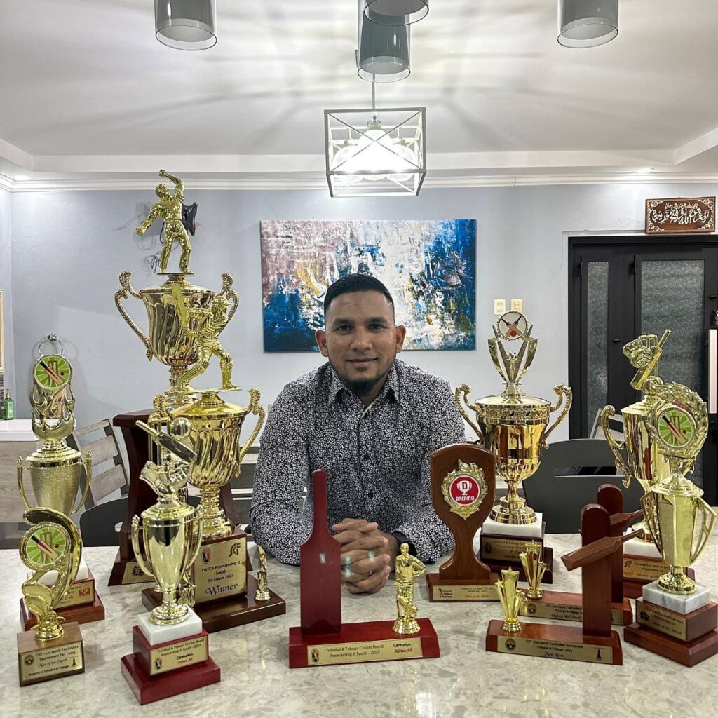 Marchin Patriots' Adrian Ali with some of the trophies the club won on Saturday at the annual TTCB awards. - 