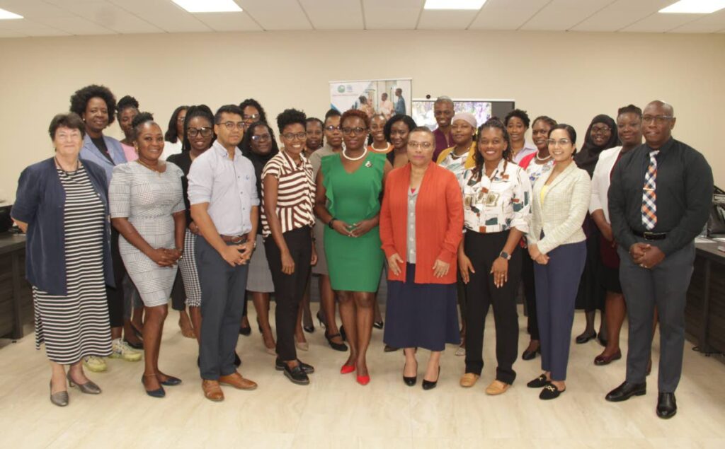 Health Secretary Dr Faith BYisrael, centre, with participants of a gender-based violence workshop at the THA's Division of Health, Wellness and Social Protection, Scarborough, on Wednesday. - THA