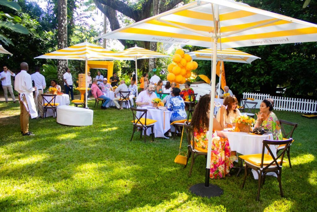 Guests in garden chic attire at the Veuve Clicquot Champagne tea party at Veronique's in St Clair, Port of Spain. - 