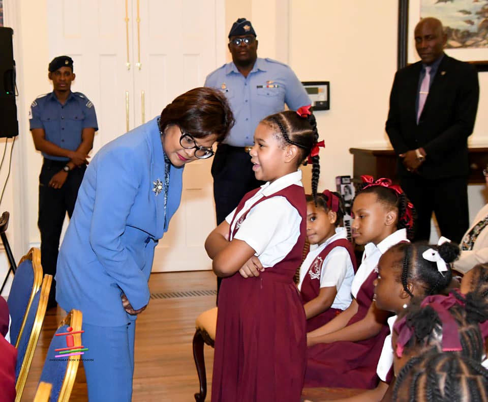 President Christine Kangaloo listens as a schoolgirl as she hosted the second Storytime at The President's House on October 4. - Photo courtesy Office of the President 