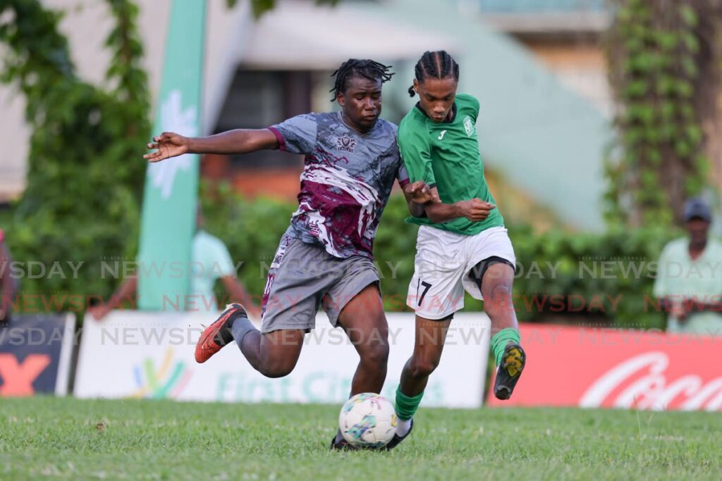 San Juan North Secondary Jahdel Chase-Charles, right, and Bishop's High Adriano Murray vie for possession during the Secondary School Football League Premiership match at the San Juan North Secondary, on Saturday, in San Juan. - Daniel Prentice