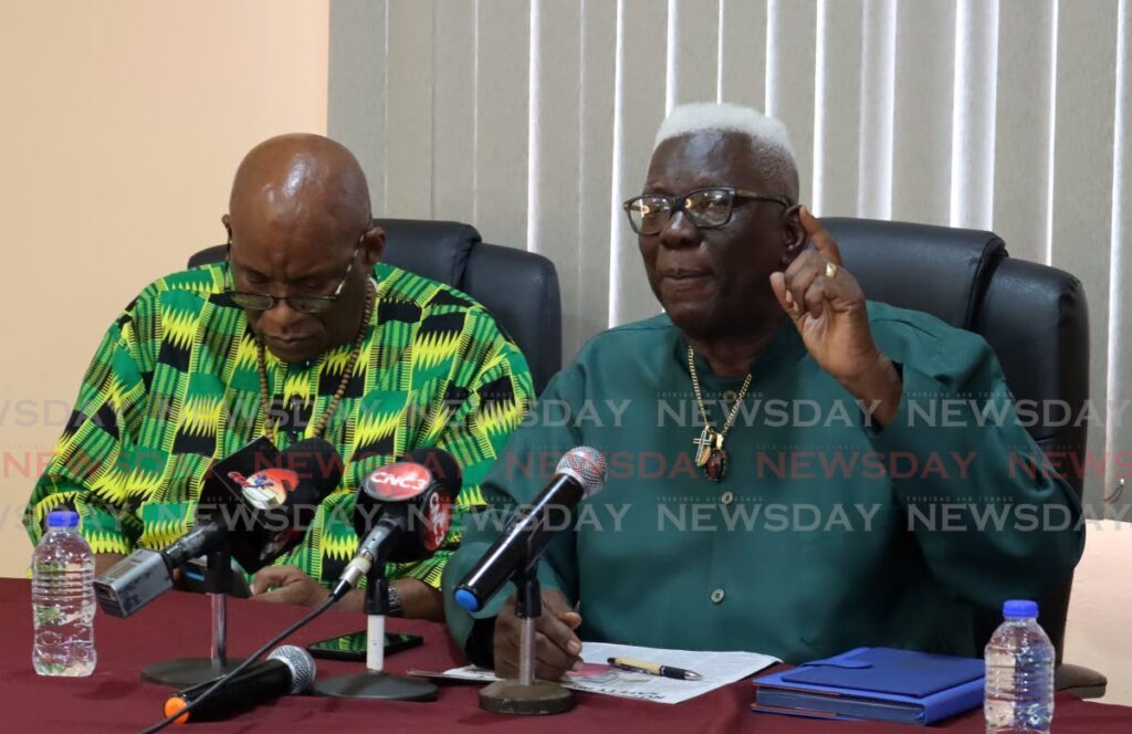 NUGFW president general James Lambert, right, speaks to the media, alongside NATUC general secretary Michael Annisette at NUGFW's Henry Street headquarters in Port of Spain on Monday. - Photo by Roger Jacob