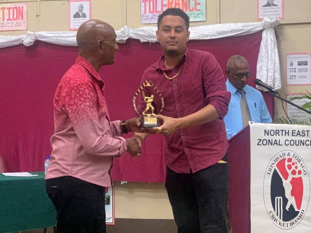 Ricardo Maikoo(L) of Unique Sports Club receives his Best Player Award in the senior division from the third vice-president of the TTCB, Parasram Singh, at the North East Zonal Council 2023 Prize Giving Function in Sangre Grande on Saturday. - TT Cricket Board