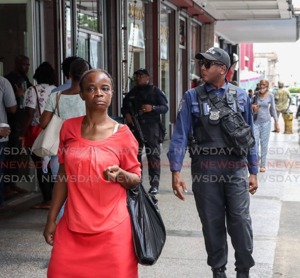 Police patrol Frederick Street Port of Spain. - Photo by Jeff Mayers