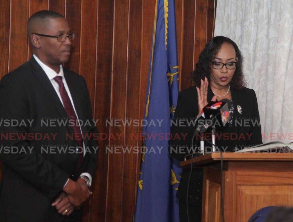 In this file photo, former chief magistrate Marcia Ayers-Caesar takes the oath as a judge while CJ Archie looks on in April 2017 at President's House. - 