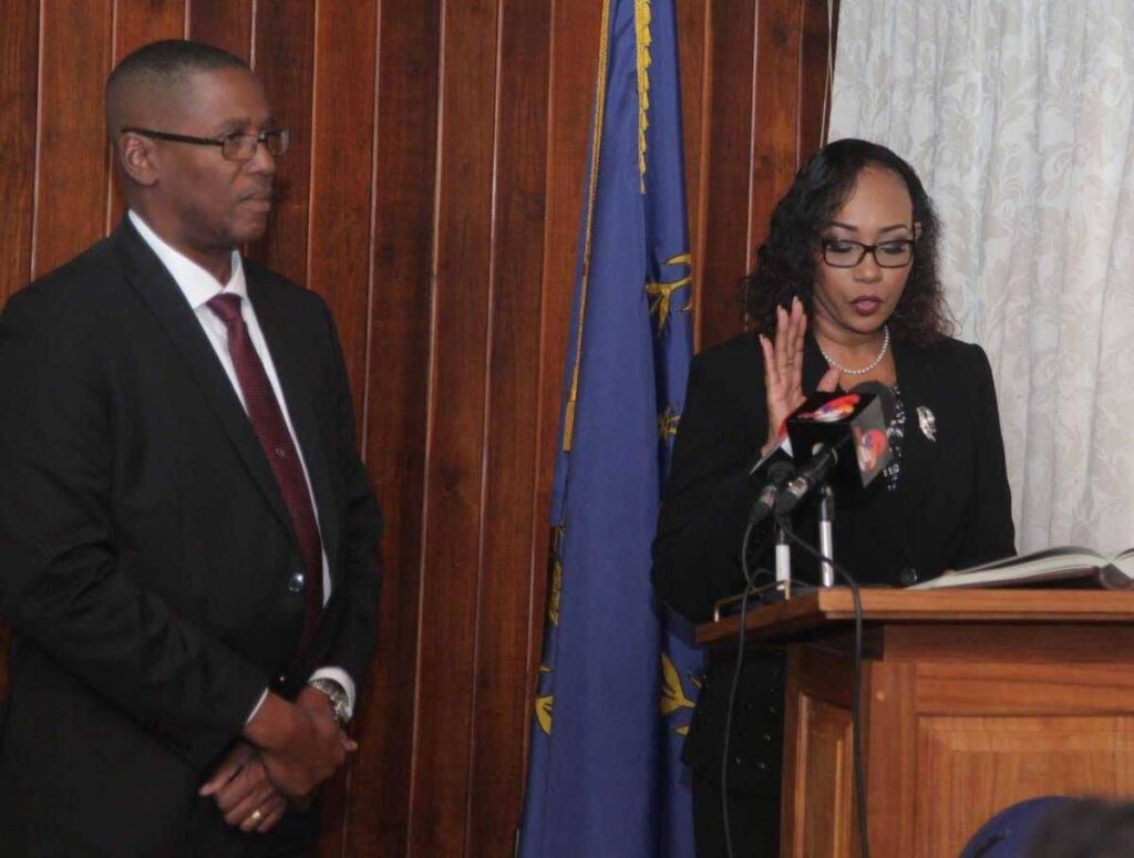 In this file photo, Marcia Ayers-Caesar takes the oath as a judge while CJ Archie looks on in 2017 at President's House.  - 