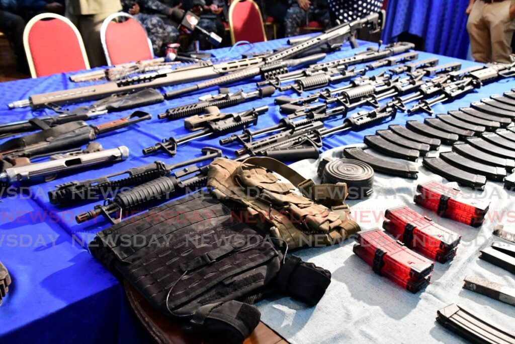 Some of the weapons and ammunition found by police during and exercise in Santa Cruz on Wednesday. - TTPS