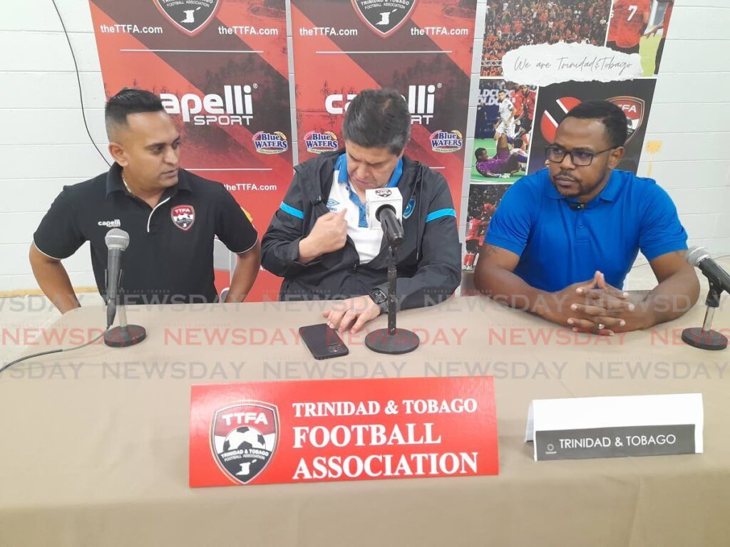 Guatemala men’s football team coach Luis Fernando Tena (C) prepares to address the media ahead of his team’s Concacaf Nations League A match versus TT at the Hasely Crawford Stadium, Mucurapo on Friday. He is flanked by TTFA head of media Shaun Fuentes (L) and translator Luces Smith.  - Roneil Walcott