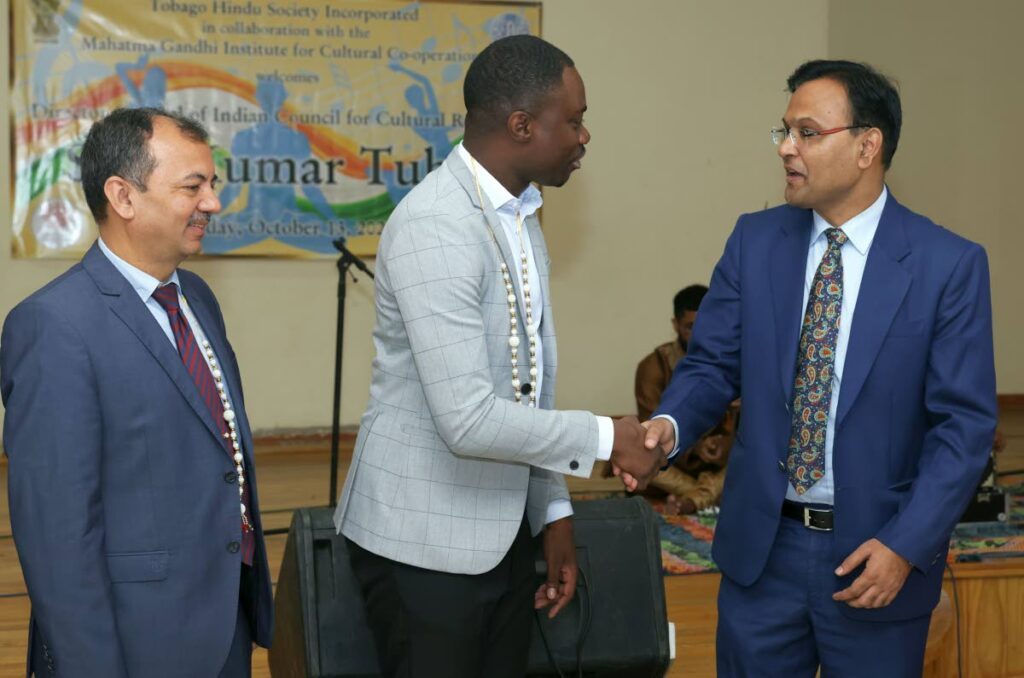 Chief Secretary of the Tobago House of Assembly Farley Augustine, centre, greets Indian High Commissioner to TT Dr Pradeep Rajpurohit during a function at the Canaan/Bon Accord Multipurpose Facility on Friday. At left, is Director General of the Indian Council for Cultural Relations Kumar Tuhin. - Photo courtesy THA 