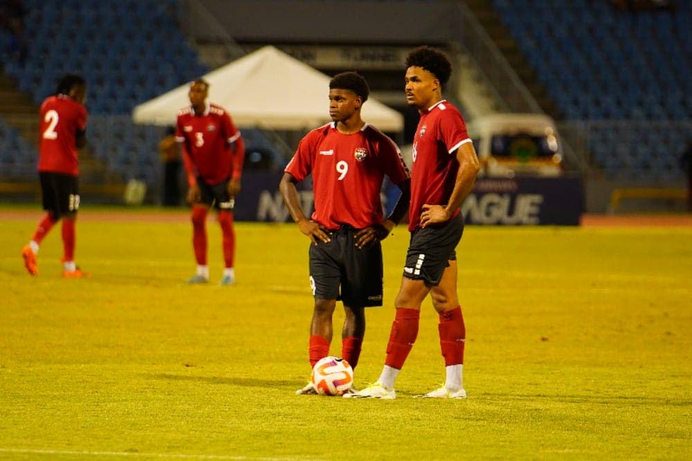 TT's Alvin Jones (R) looks on as Nathaniel James (L) prepares to take a free-kick against Guatemala, on Friday night, during their Concacaf Nations League Group A match, at the Hasely Crawford Stadium, Port of Spain. - TTFA Media