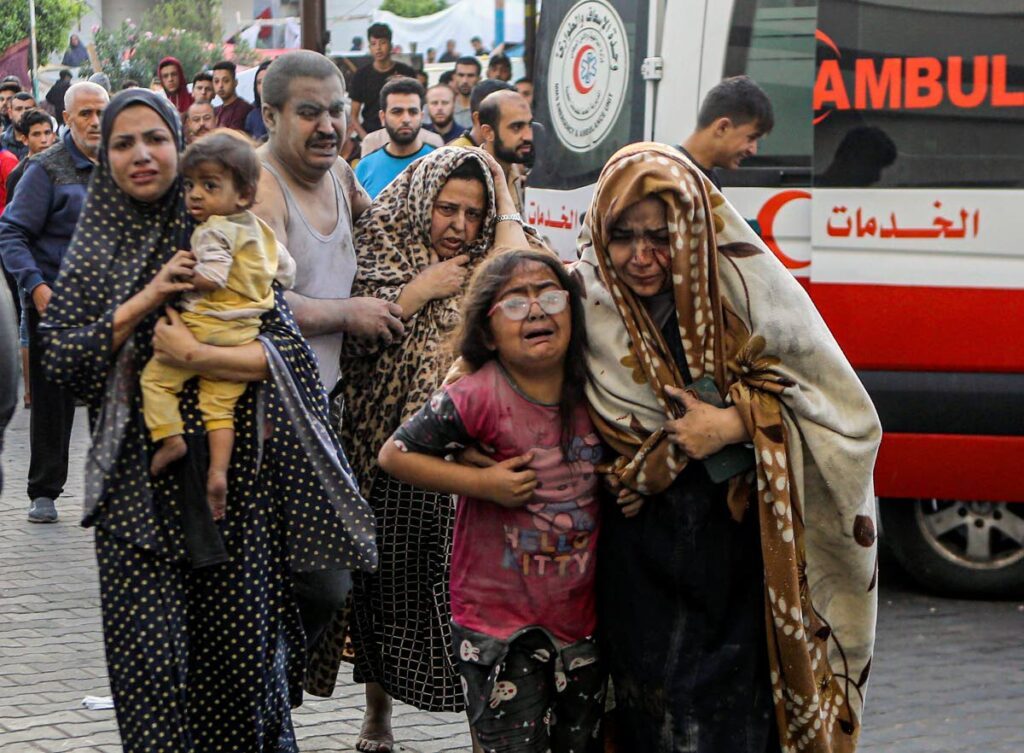 Wounded Palestinians arrive to al-Shifa hospital, following Israeli airstrikes on Gaza City, central Gaza Strip on Monday. via AP - 