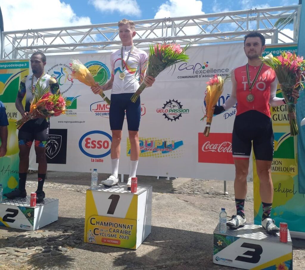 TT's Enrique De Comarmond, right, celebrates his U23 men's road race bronze at the Caribbean Road Cycling Championships in Guadeloupe on Sunday.  - Courtesy TTCF