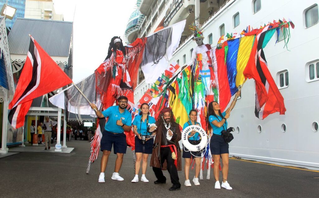 Moko jumbies welcome tourists at the start of the cruise season. - ROGER JACOB