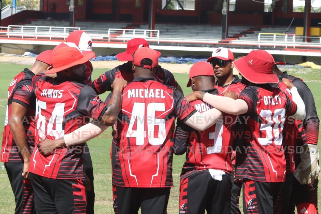 Red Force players in a huddle in a Super50 match vs CCC at the Queen's Park Oval, St Clair, Tuesday.  - ROGER JACOB