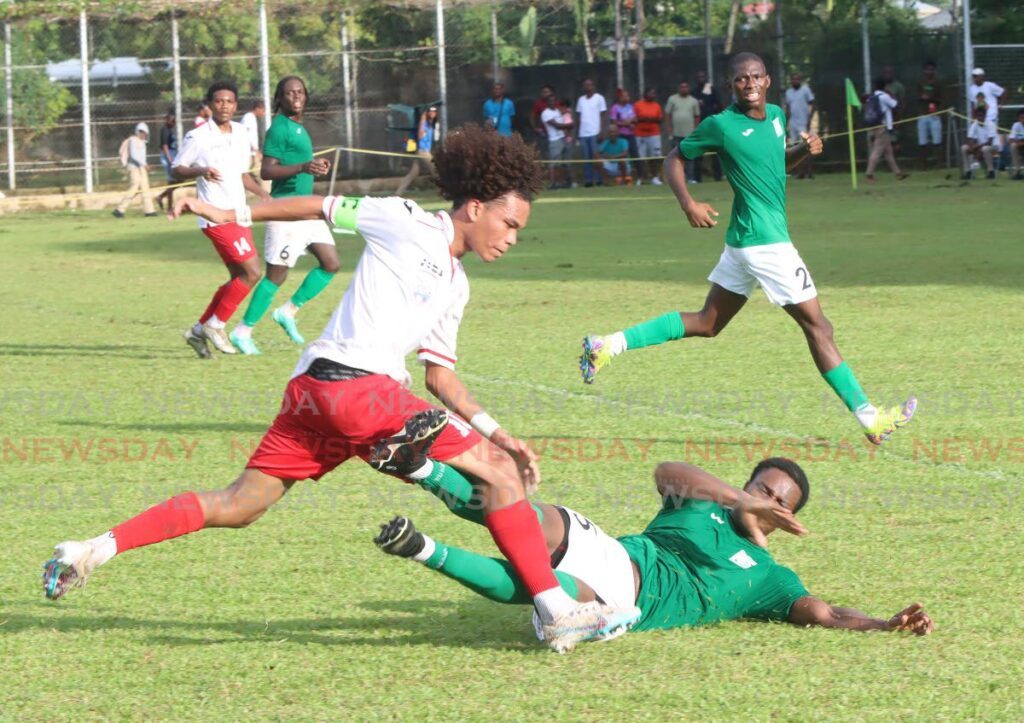 San Juan North Secondary School defender Kent Guy, slides straight through the legs of St Anthony’s College midfielder Aalon Wilson-Wright, during their Premiership Division match at St. Anthony’s College Grounds, Westmoorings on Wednesday. - Angelo Marcelle