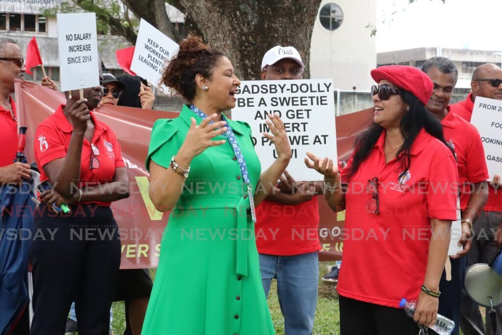 In this file photo, UWI St Augustine campus registrar Dr Dawn-Marie De Four-Gill, in green, interacts with Wigut leader Dr Indira Rampersad during a protest at the St Augustine campus. Photo by Roger Jacob