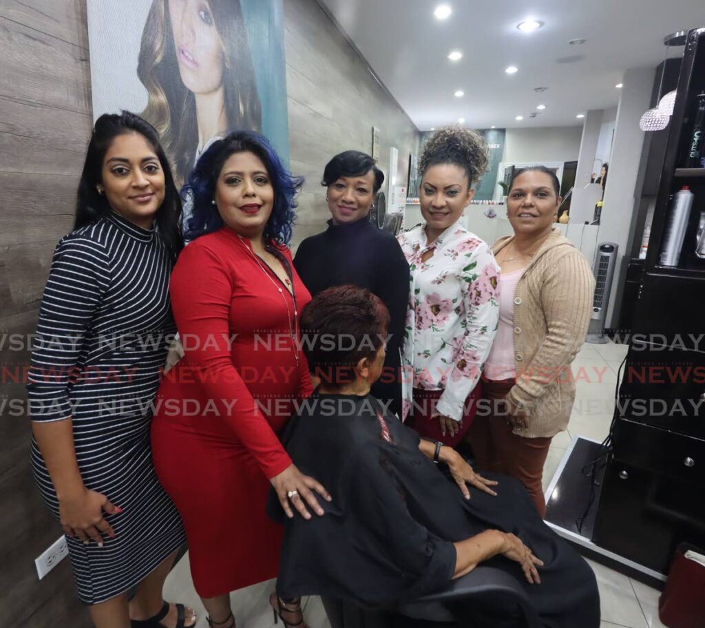 Nadia Mohammed with her staff at Nadia’s Beauty Salon in Trincity Mall.  - ROGER JACOB