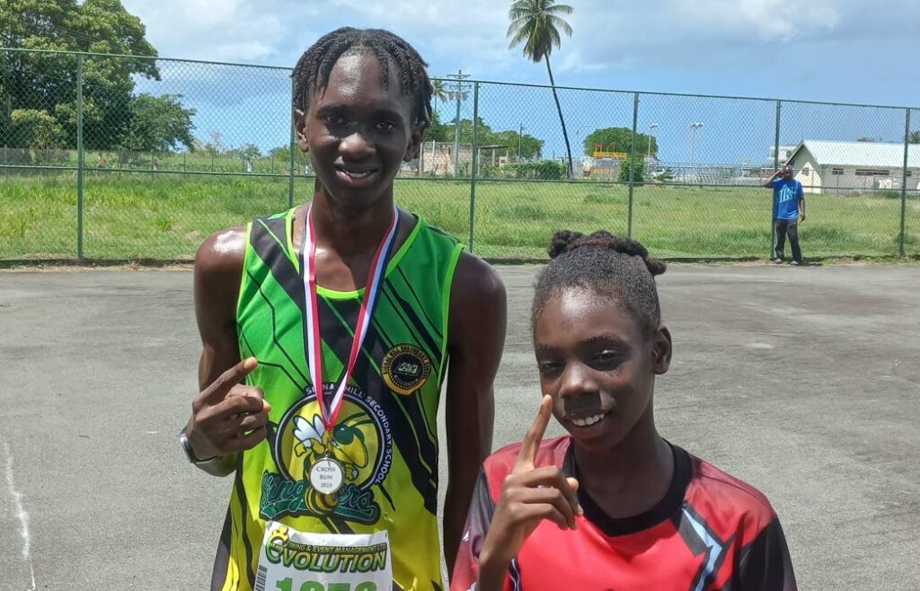 Mykhal Paria of Signal Hill Secondary, left, and Oshea Cummings of Mason Hall Secondary won the Secondary Schools Track and Field cross-run in Tobago on Wednesday.  - 