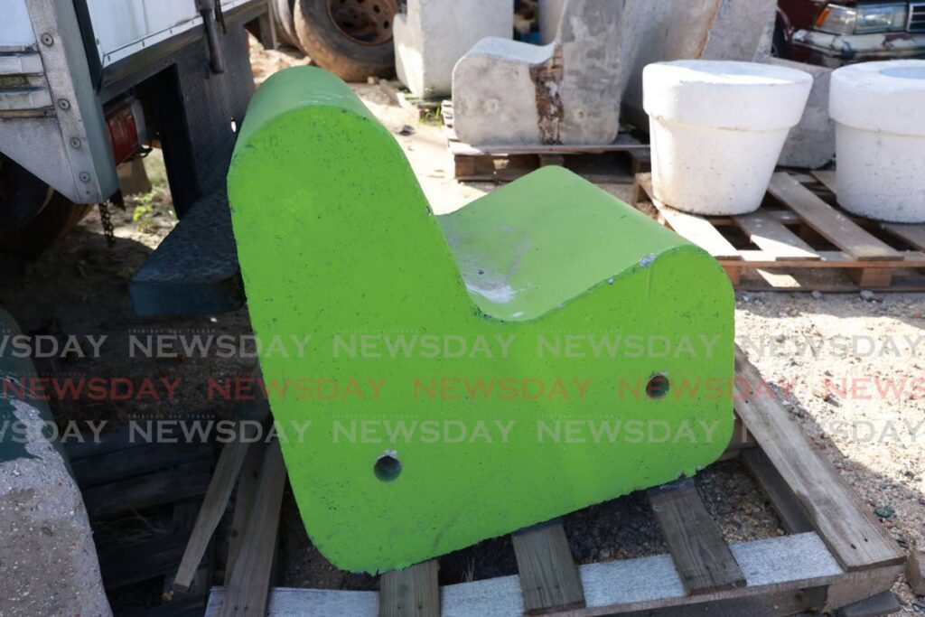 A seat made from recycled plastic and concrete at the Flying  Tree factory. - Jeff K. Mayers