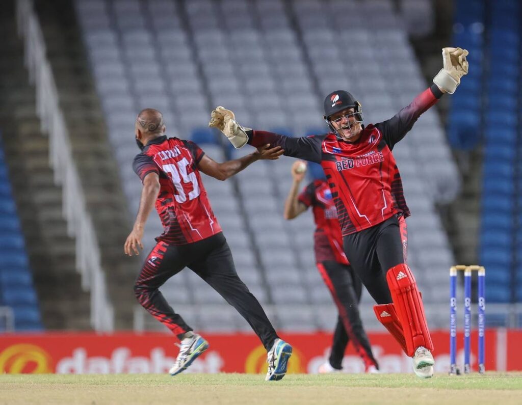 Red Force spinner Yannic Cariah, left, celebrates a wicket with wicketkeeper Joshua Da Silva, right, during a CG United Super50 match against Guyana Harpy Eagles on Saturday, at the Brian Lara Cricket Academy, Tarouba.  - CWI Media 
