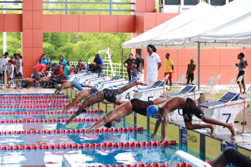 Athletes hit the water in the boys nine and over 25m freestyle, in the non-competitive category, at the Tidal Wave Aquatics Inter-Zone Schools Swim Meet on Sunday. - Photo by Jeff K Mayers