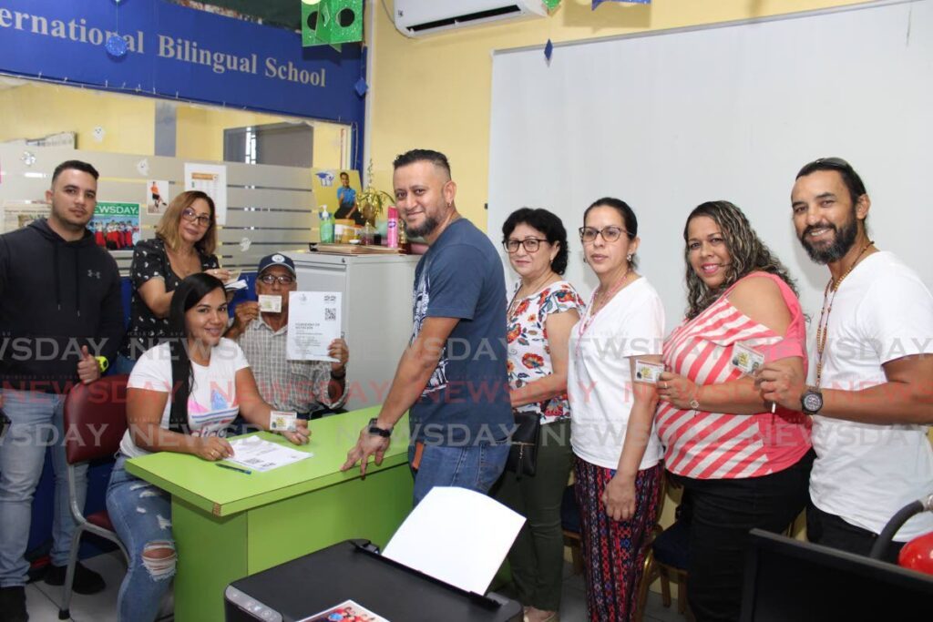 From left: Danny Chan, Orlando Chan, of Selia Rodriguez de Chan, Mariglee Mora de Chan, Vanessa Martinez de Chan travelled from Arima to Chaguanas to participate in the Venezuelan opposition primaries at a polling station at Langdons Language Institute, on Sunday. PHOTO BY GREVIC ALVARADO - GREVIC ALVARADO