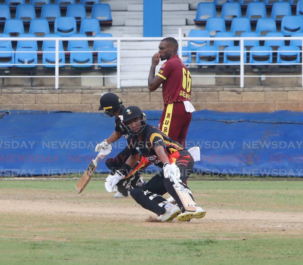Guyana Harpy Eagles' Tagenarine Chanderpaul (R) and Kemol Savory run between the wickets during the Regional Super50 Cup match against Leeward Islands Hurricanes, on Monday, at the Queen's Park Oval, St Clair.  - ROGER JACOB