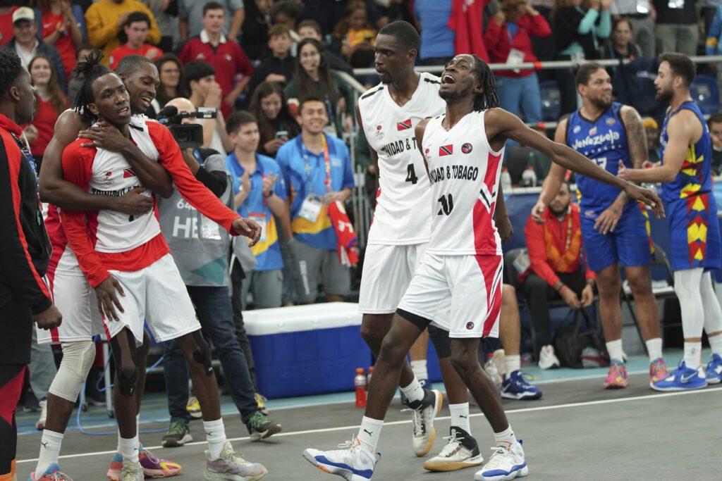 Trinidad Tobago players celebrate the bronze medal win in men's 3x3 basketball event of the Pan American Games in Santiago, Chile, Monday, Oct. 23, 2023. (AP Photo/Dolores Ochoa)