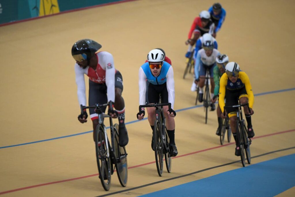 Trinidad and Tobago's Akil Campbell, left, in action in the men's omnium track cycling event of the Pan American Games at the Velodrome in the Peñalolen Park in Santiago, Chile, Tuesday. - AFP PHOTO