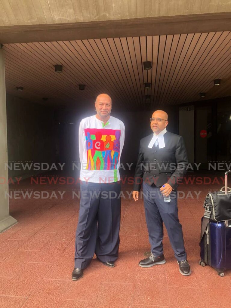 FIGHTING FOR EQUALITY: Trinidadian LGBTQIA+ activist Jason Jones and one of his attorneys, Rishi Dass, SC, at the Hall of Justice, Port of Spain, on Wednesday. - Jada Loutoo